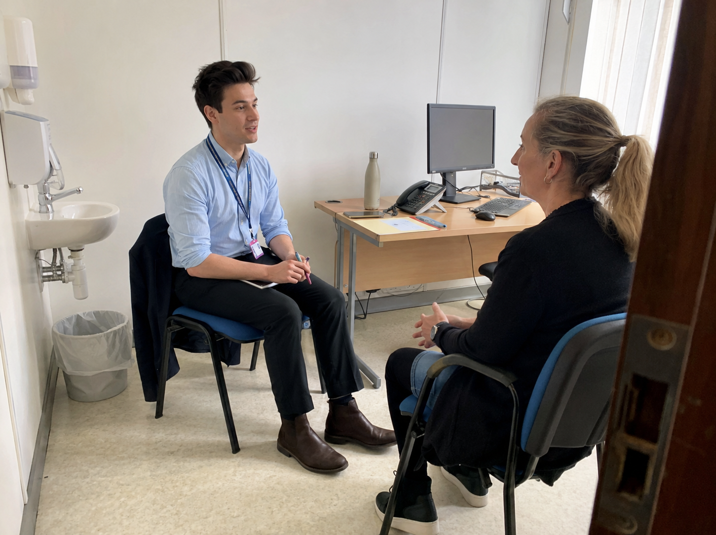 Medical student in consultation with a standardised patient in a clinical skills room